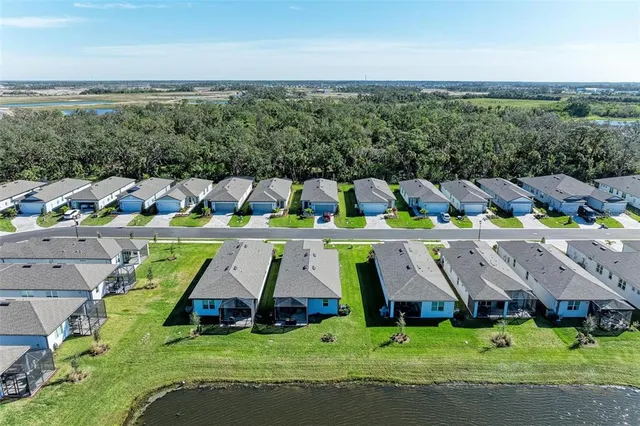 an aerial view of a house with a garden and plants