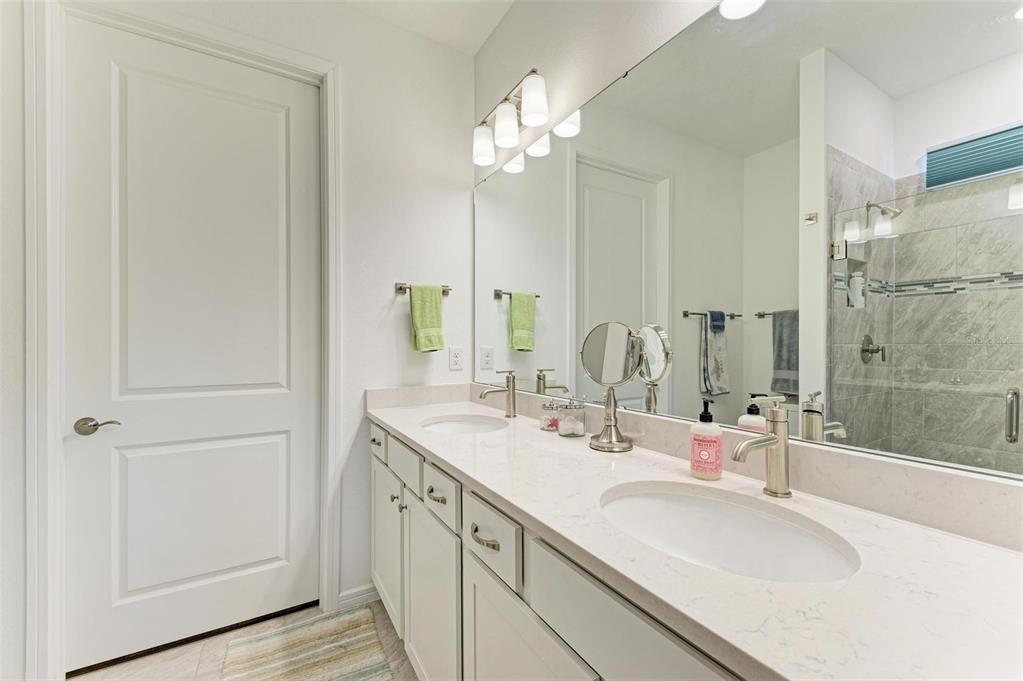 9272 Ballaster Pointe Loop Parrish, FL 34221 - Photo 25 of 79 a bathroom with a sink and a mirror