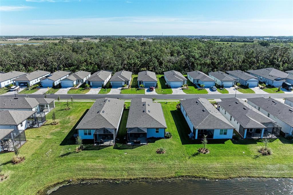 9272 Ballaster Pointe Loop Parrish, FL 34221 - Photo 39 of 79 an aerial view of a house with swimming pool patio and mountain view in back
