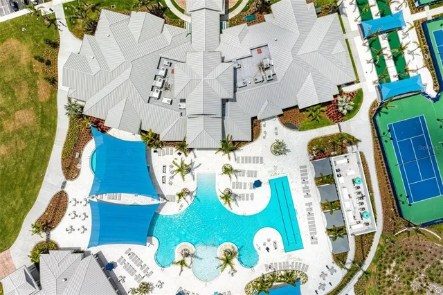 a view of a living room a window and a wooden floor