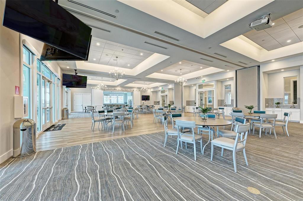 9272 Ballaster Pointe Loop Parrish, FL 34221 - Photo 63 of 79 a dining room with lots of wooden furniture and wooden floor