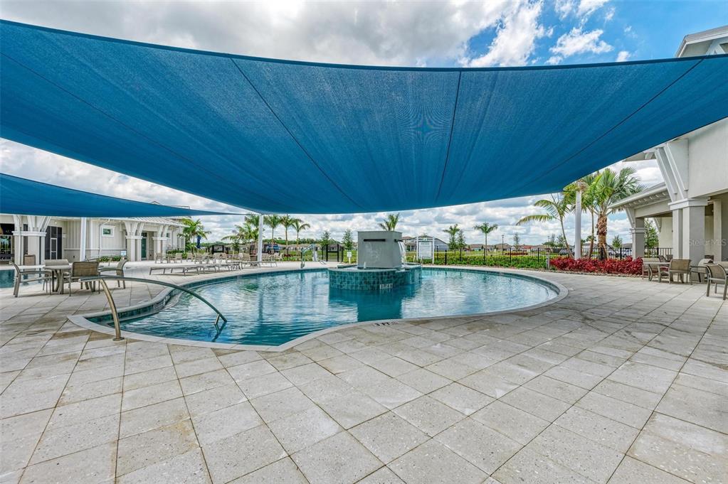 9272 Ballaster Pointe Loop Parrish, FL 34221 - Photo 78 of 79 a view of a swimming pool and lounge chair