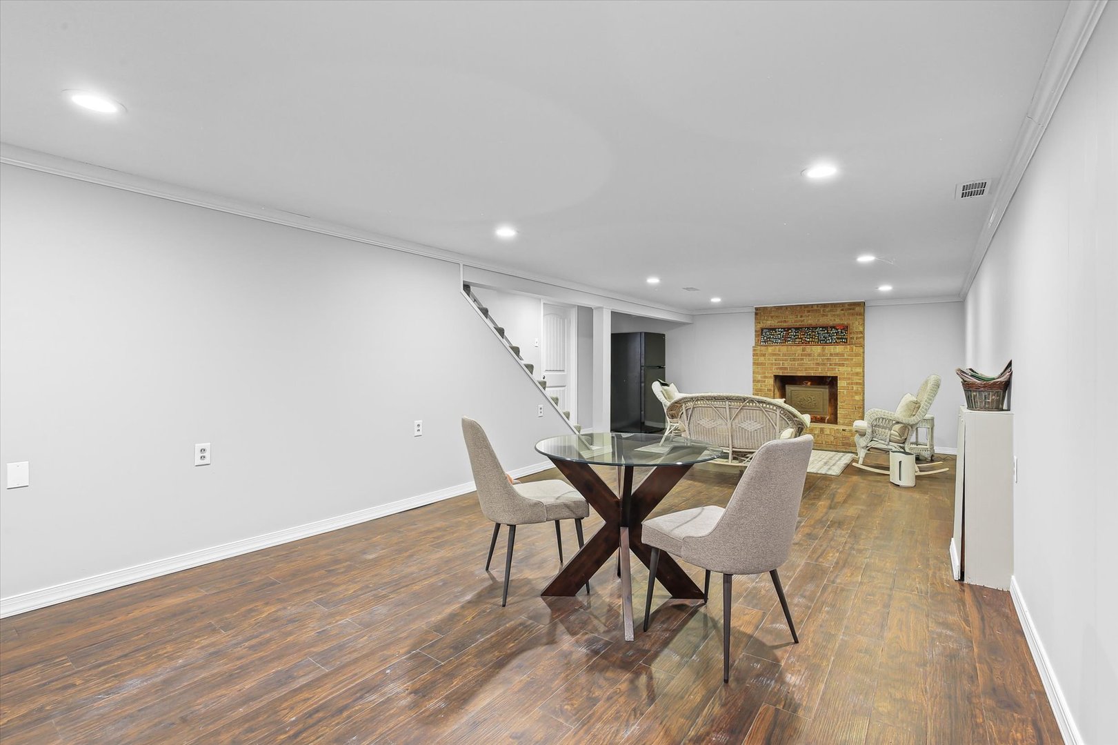 201 Ellis Avenue Normal, IL 61761 - Photo 22 of 28 a view of a dining room with furniture and a wooden floor