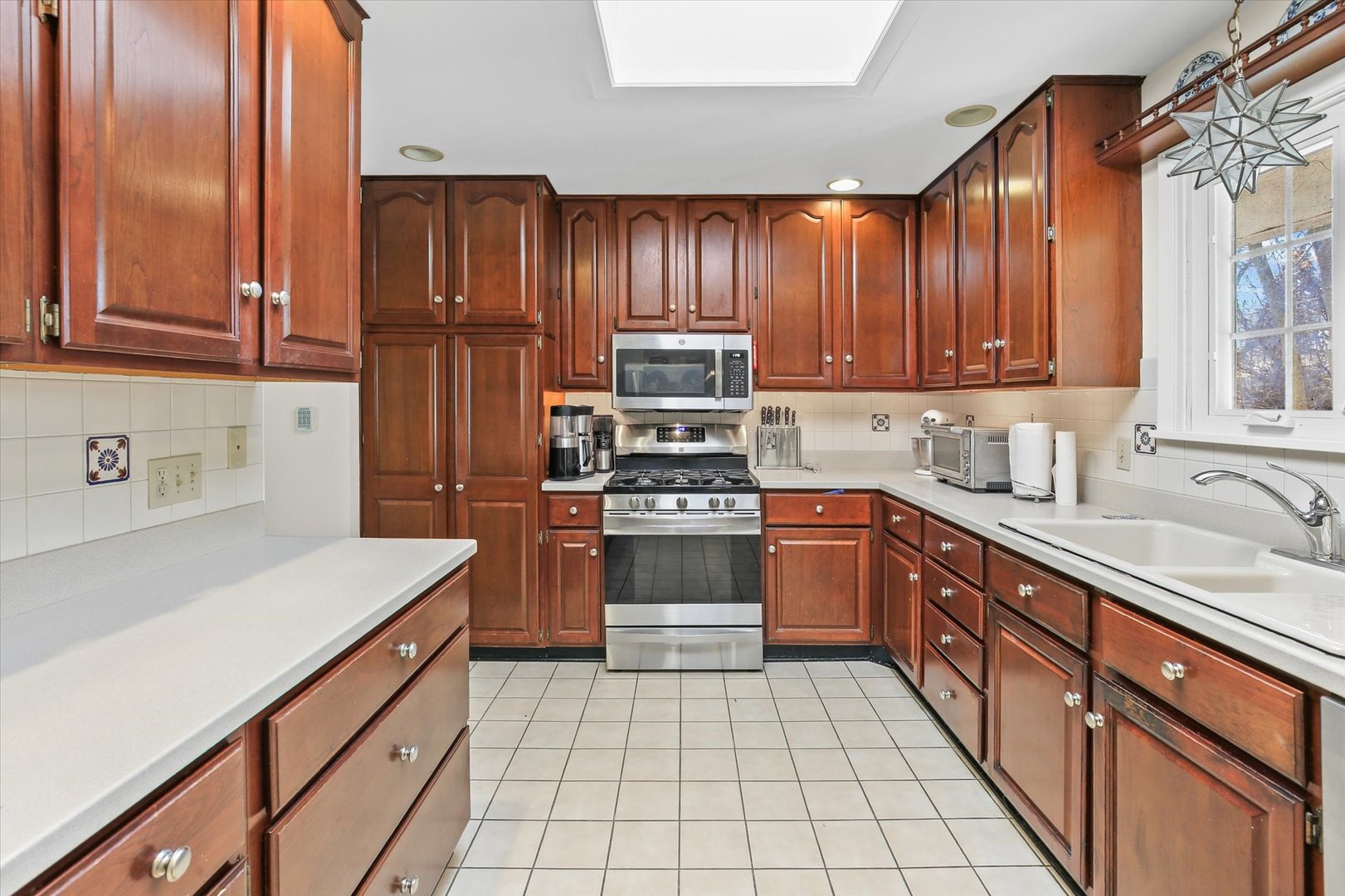 201 Ellis Avenue Normal, IL 61761 - Photo 10 of 28 a kitchen with granite countertop wooden cabinets and white appliances
