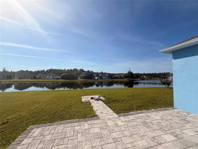 a view of a lake with a garden