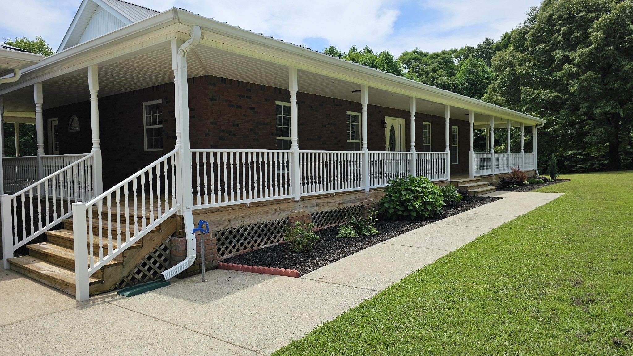 10985 Missionary Ridge Road Bon Aqua, TN 37025 - Photo 15 of 43 a view of a house with backyard and porch