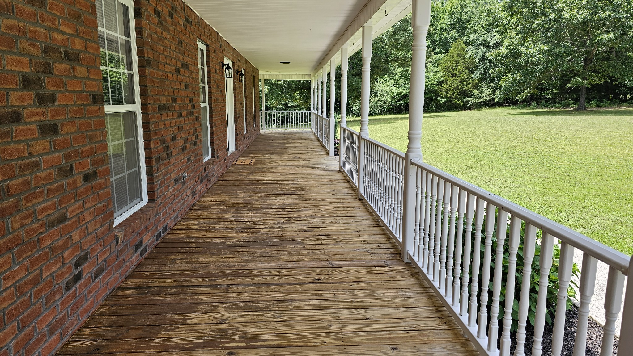 10985 Missionary Ridge Road Bon Aqua, TN 37025 - Photo 17 of 43 a view of a balcony with wooden floor