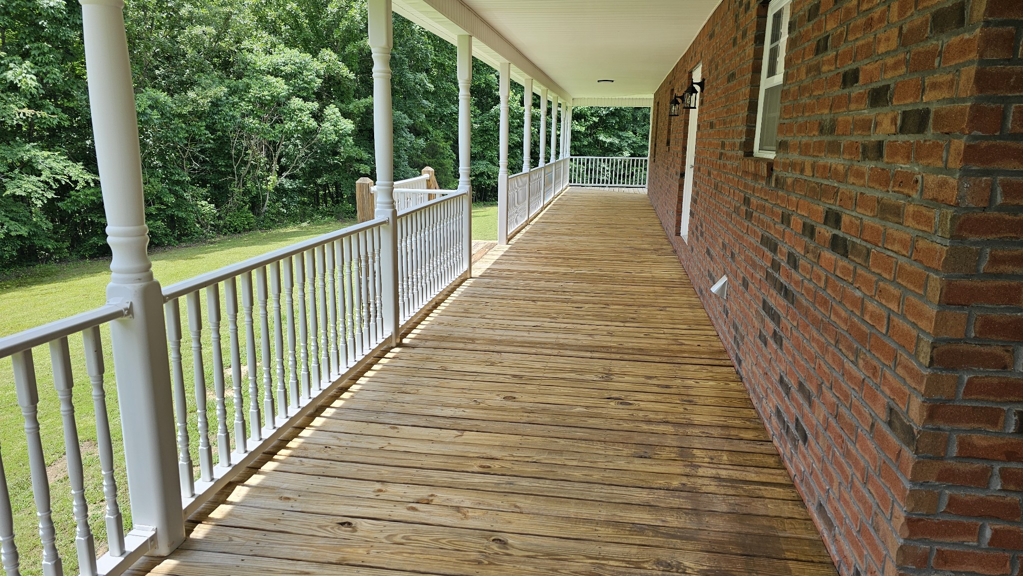 10985 Missionary Ridge Road Bon Aqua, TN 37025 - Photo 19 of 43 a view of a balcony with wooden floor