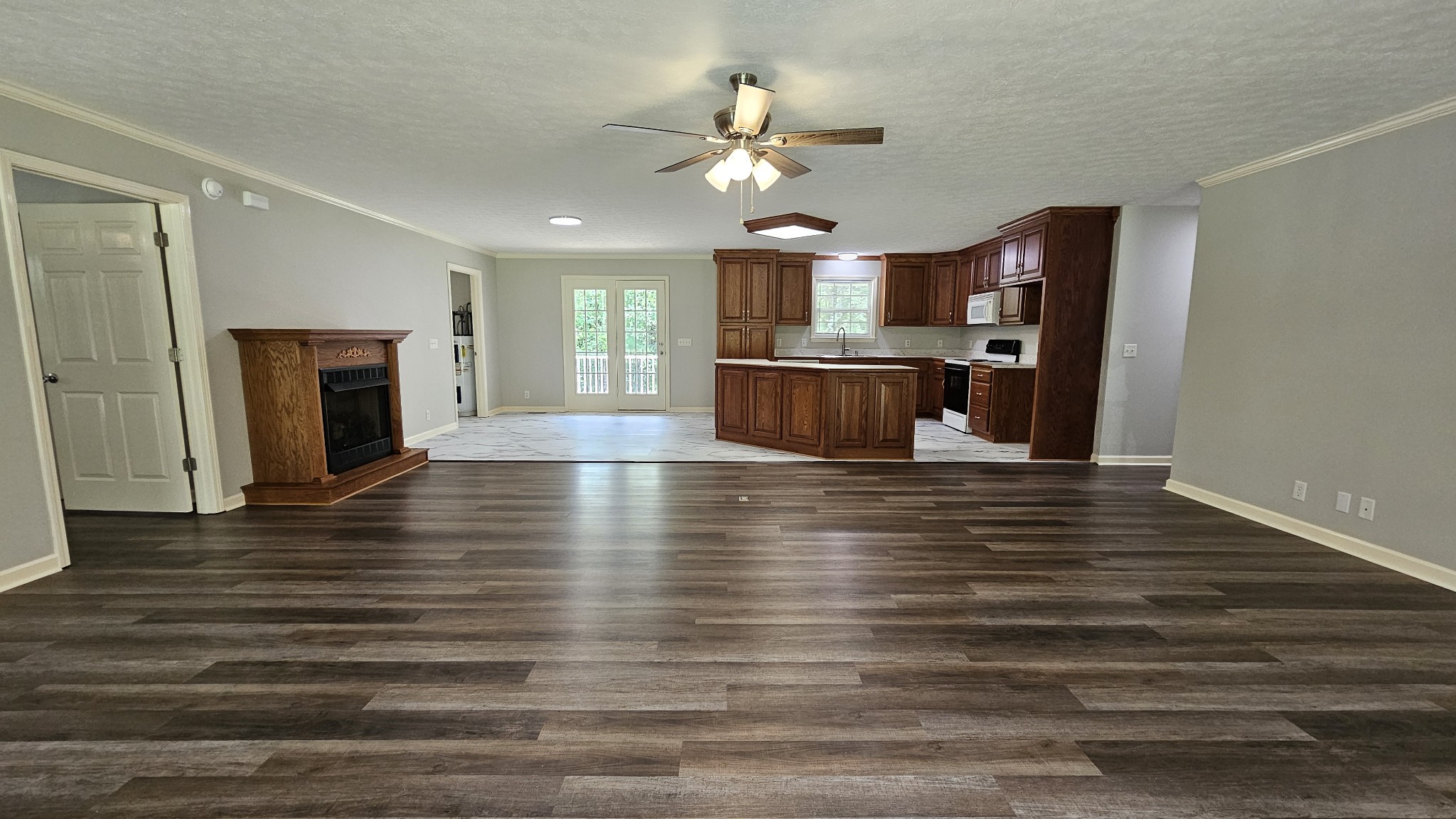 10985 Missionary Ridge Road Bon Aqua, TN 37025 - Photo 21 of 43 a view of a kitchen with wooden floor and a fireplace