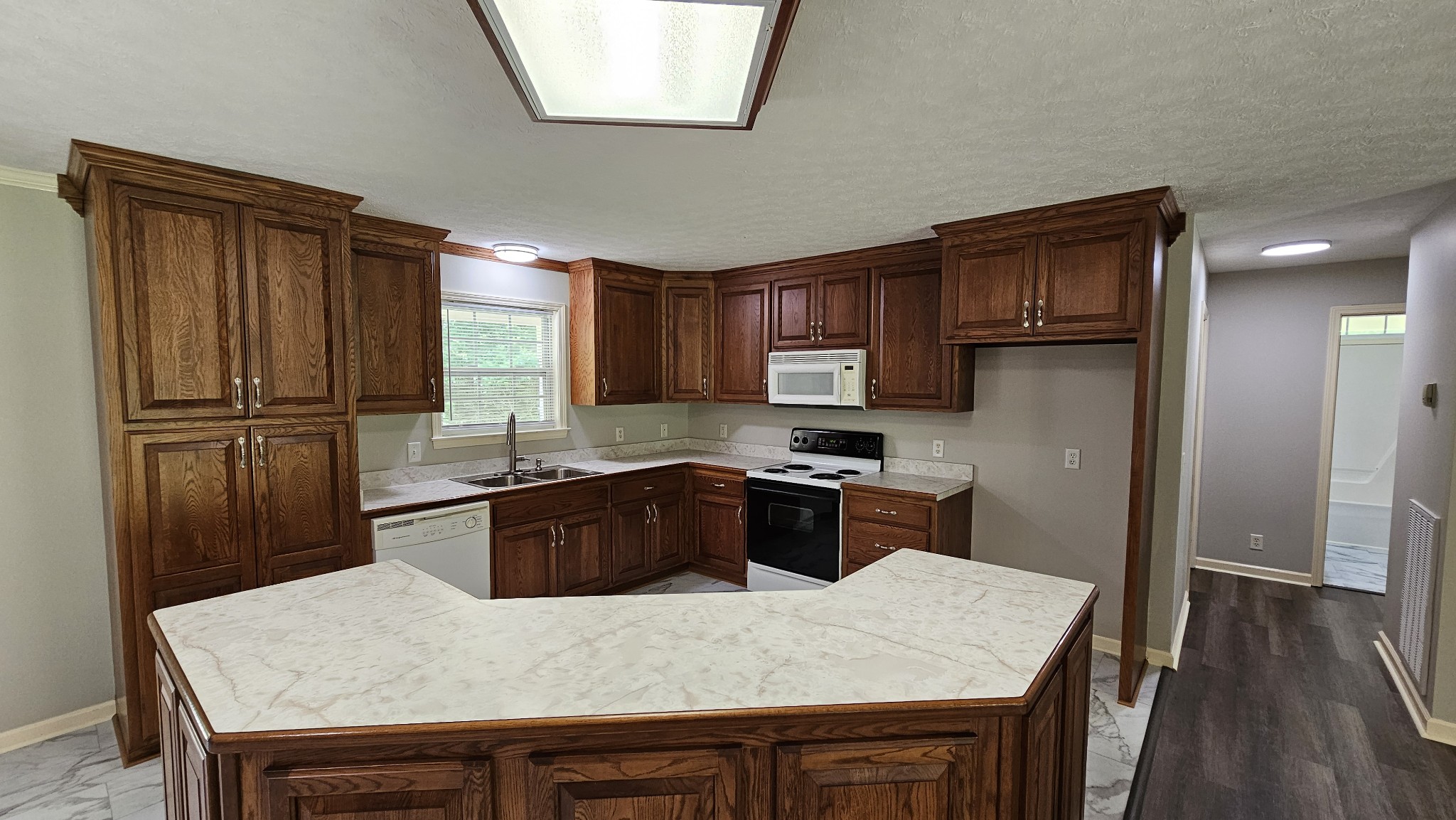 10985 Missionary Ridge Road Bon Aqua, TN 37025 - Photo 25 of 43 a kitchen with granite countertop a refrigerator stove and sink
