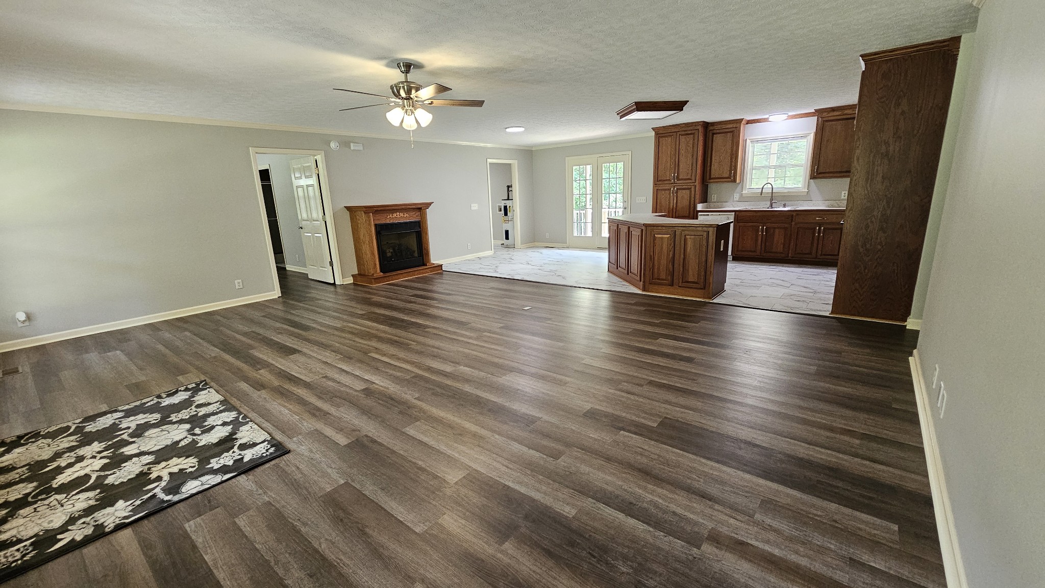 10985 Missionary Ridge Road Bon Aqua, TN 37025 - Photo 28 of 43 wooden floor in an empty room with a fireplace