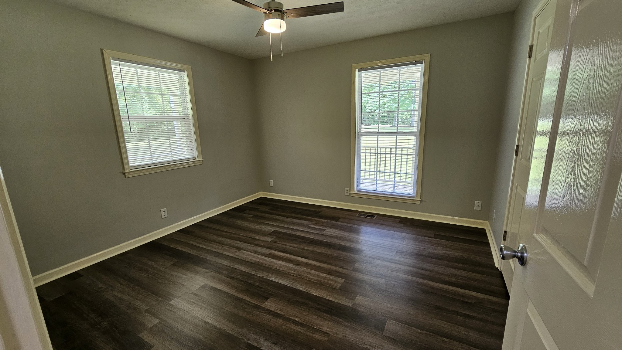 10985 Missionary Ridge Road Bon Aqua, TN 37025 - Photo 40 of 43 an empty room with wooden floor and windows