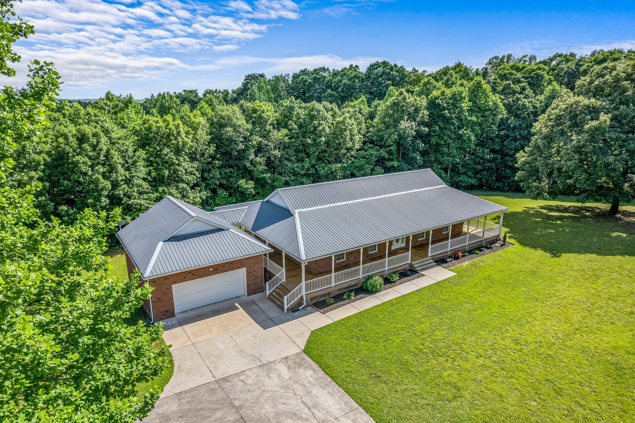 10985 Missionary Ridge Road Bon Aqua, TN 37025 - Photo 4 of 43 an aerial view of a house with a yard