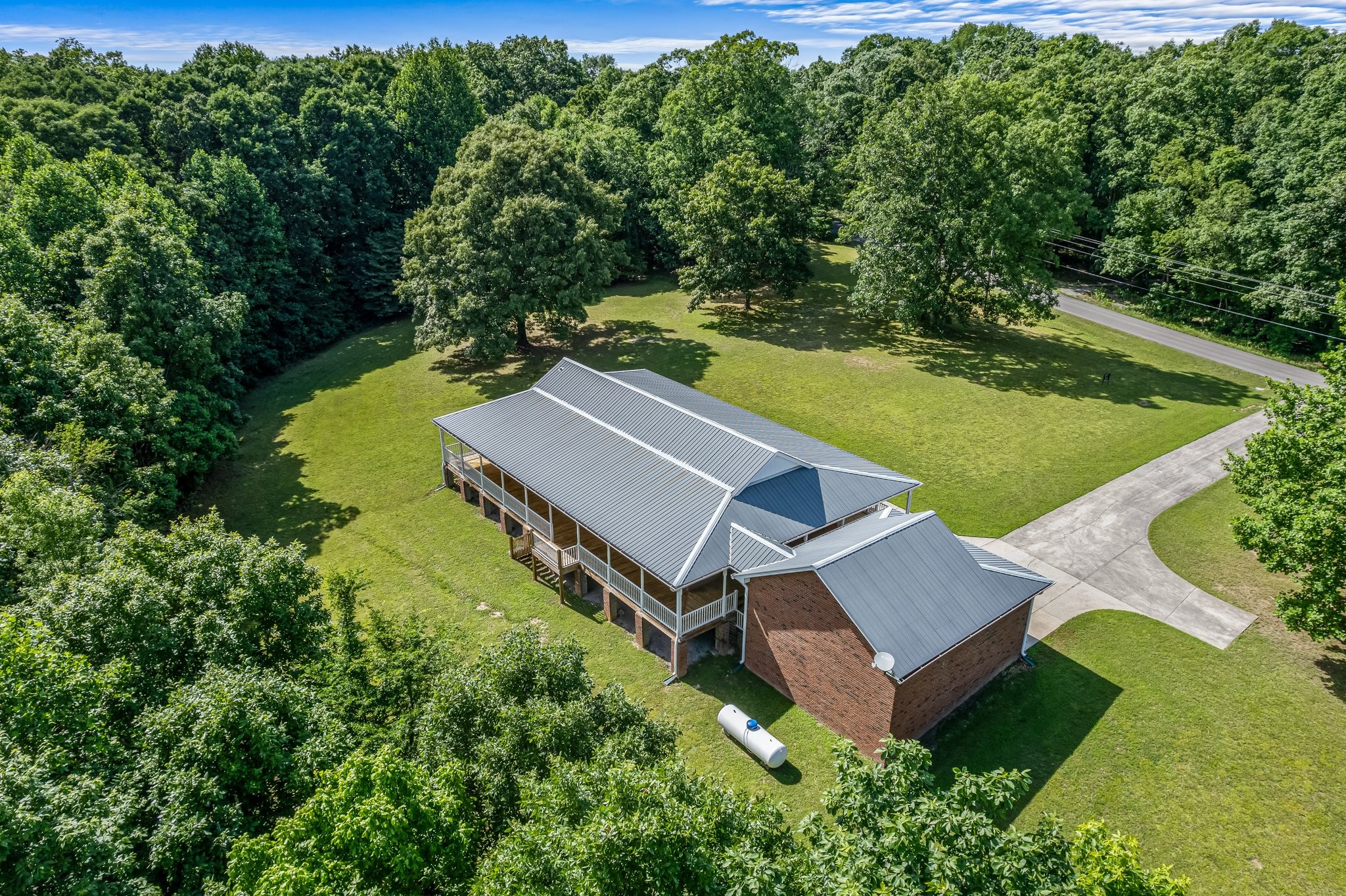 10985 Missionary Ridge Road Bon Aqua, TN 37025 - Photo 5 of 43 an aerial view of a house with swimming pool and garden
