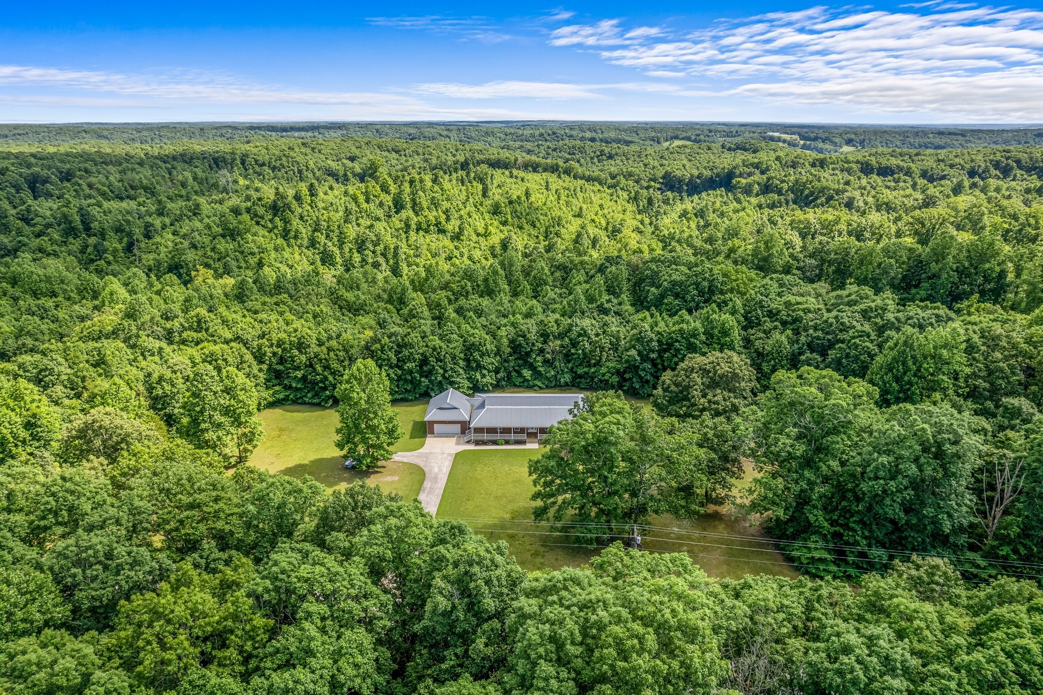 10985 Missionary Ridge Road Bon Aqua, TN 37025 - Photo 7 of 43 a view of a yard with plants and a fountain