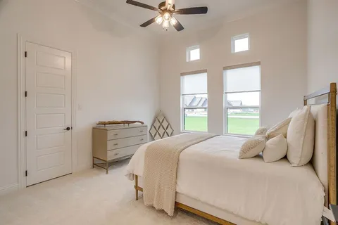 a bedroom with a bed and window