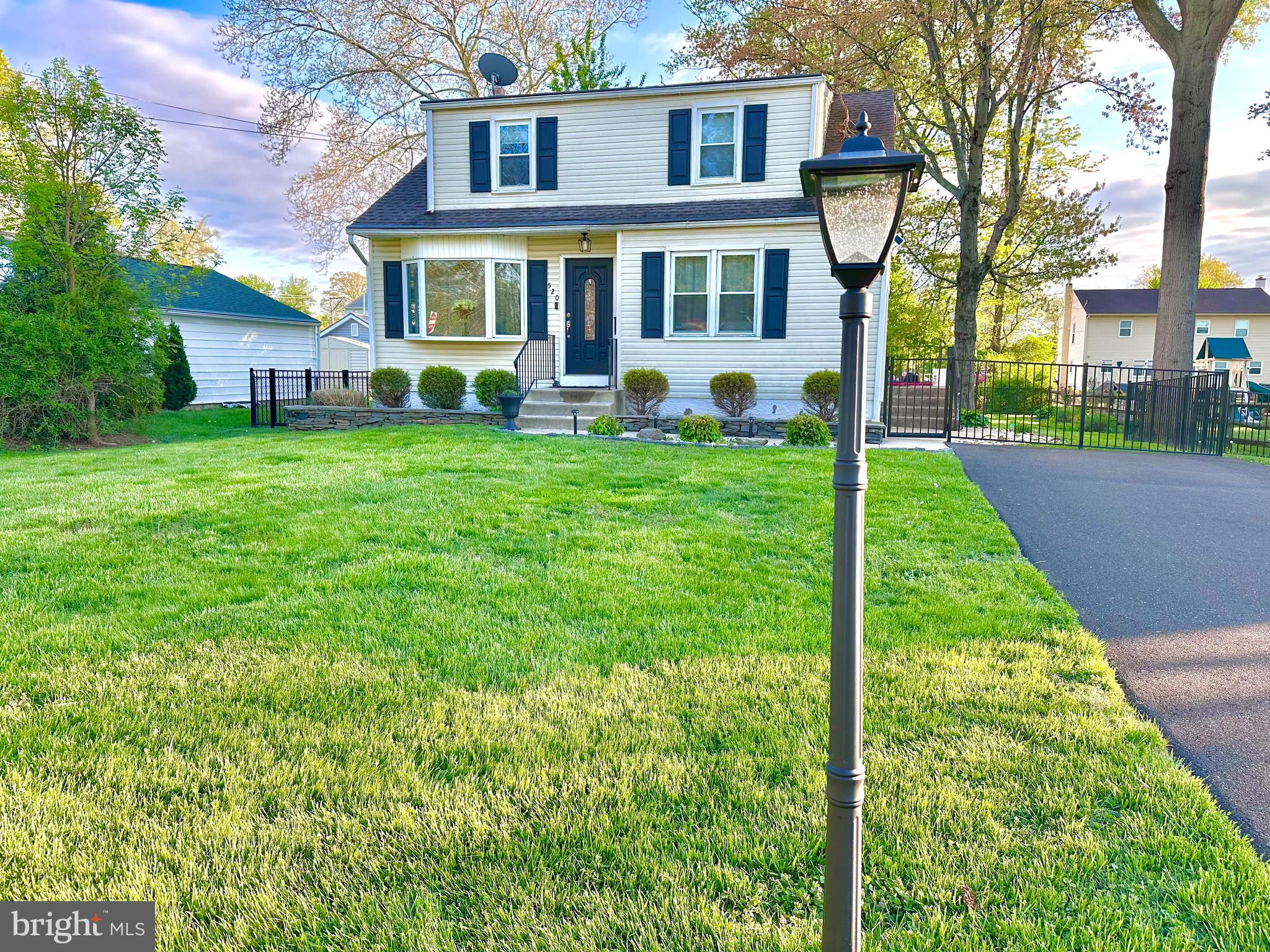 520 Olive Street Warminster, PA 18974 - Photo 1 of 8 a view of a brick house with a yard and plants