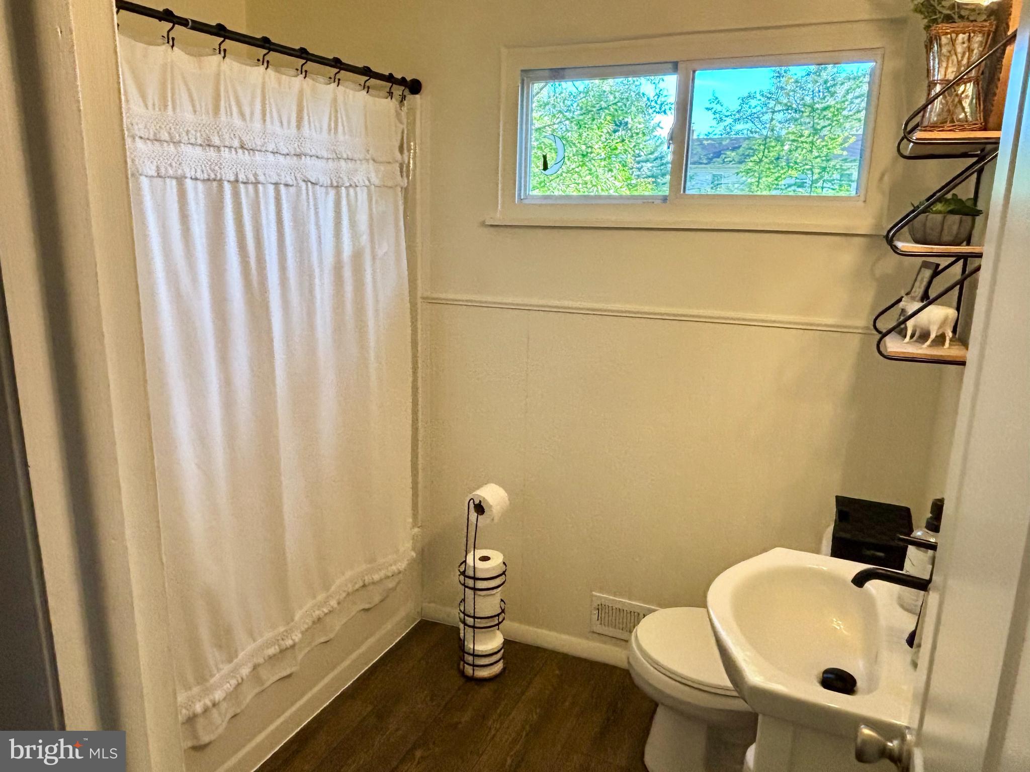 520 Olive Street Warminster, PA 18974 - Photo 3 of 8 a bathroom with a sink and a toilet