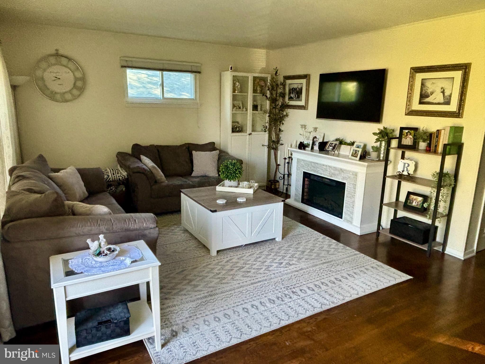 520 Olive Street Warminster, PA 18974 - Photo 5 of 8 a living room with furniture and a flat screen tv
