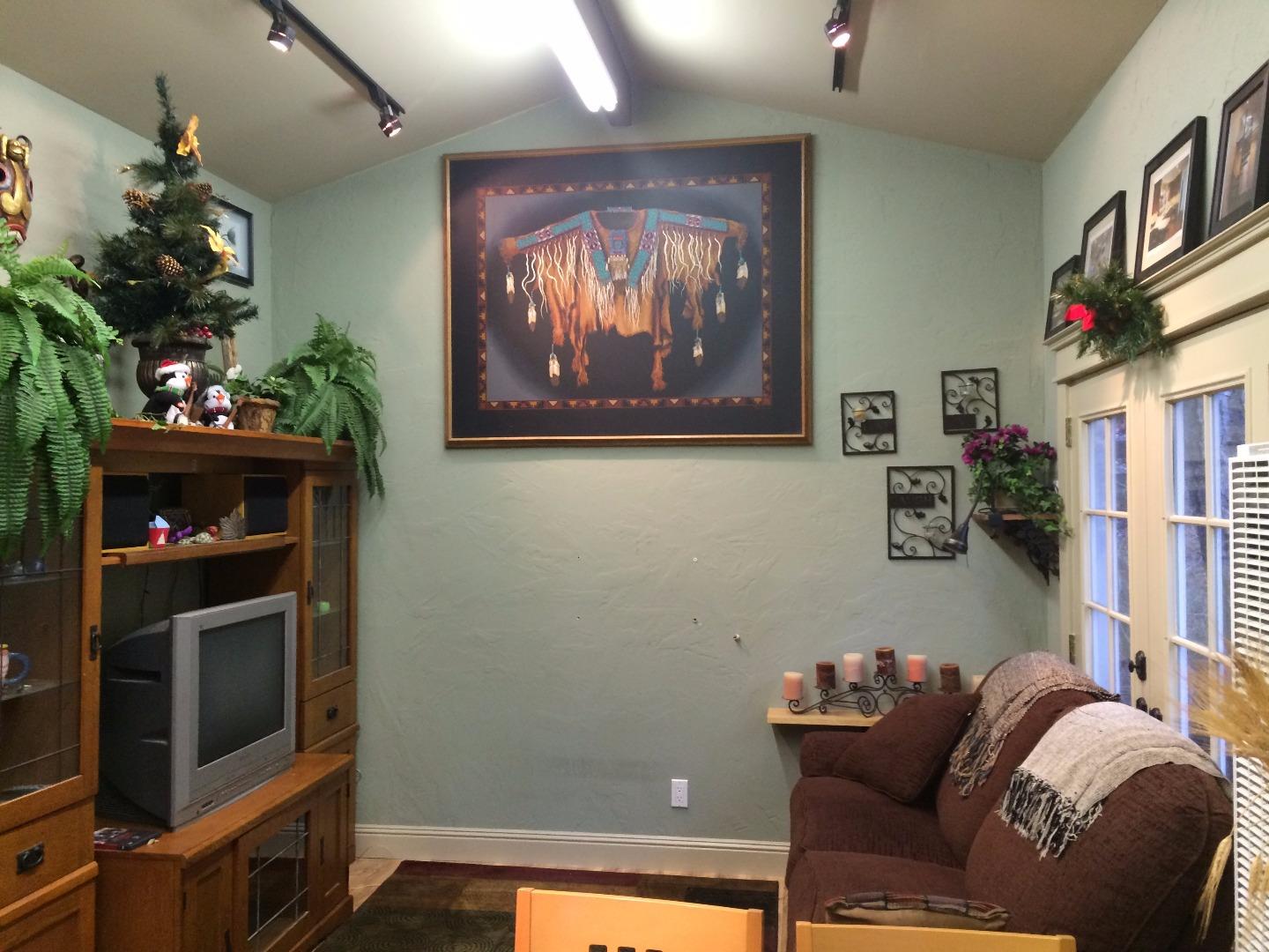 Sugarloaf Road Scotts Valley, CA 95066 - Photo 27 of 38 a living room with furniture a flowers and a fireplace