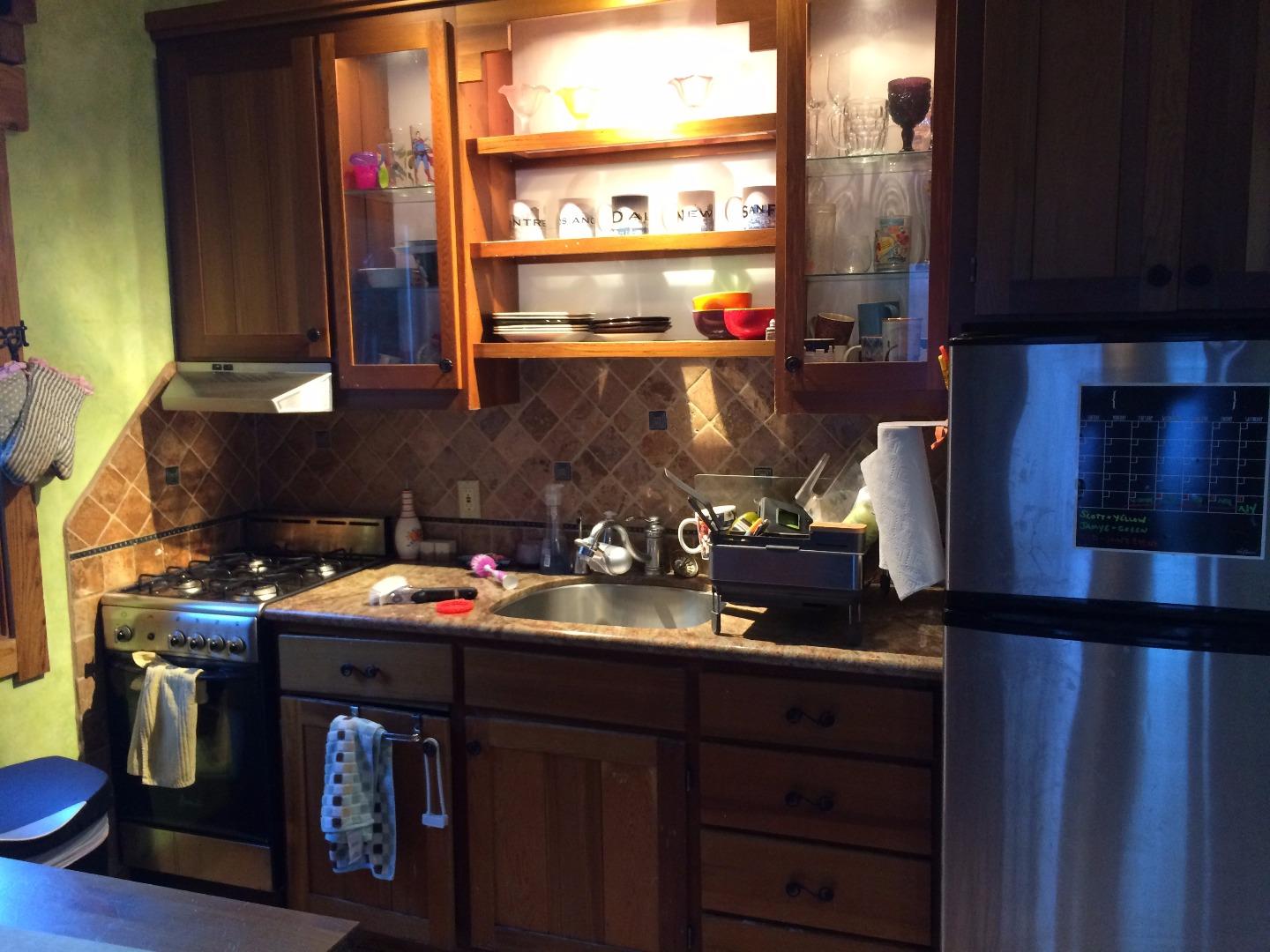 Sugarloaf Road Scotts Valley, CA 95066 - Photo 4 of 38 a kitchen with a sink and a stove next to a window