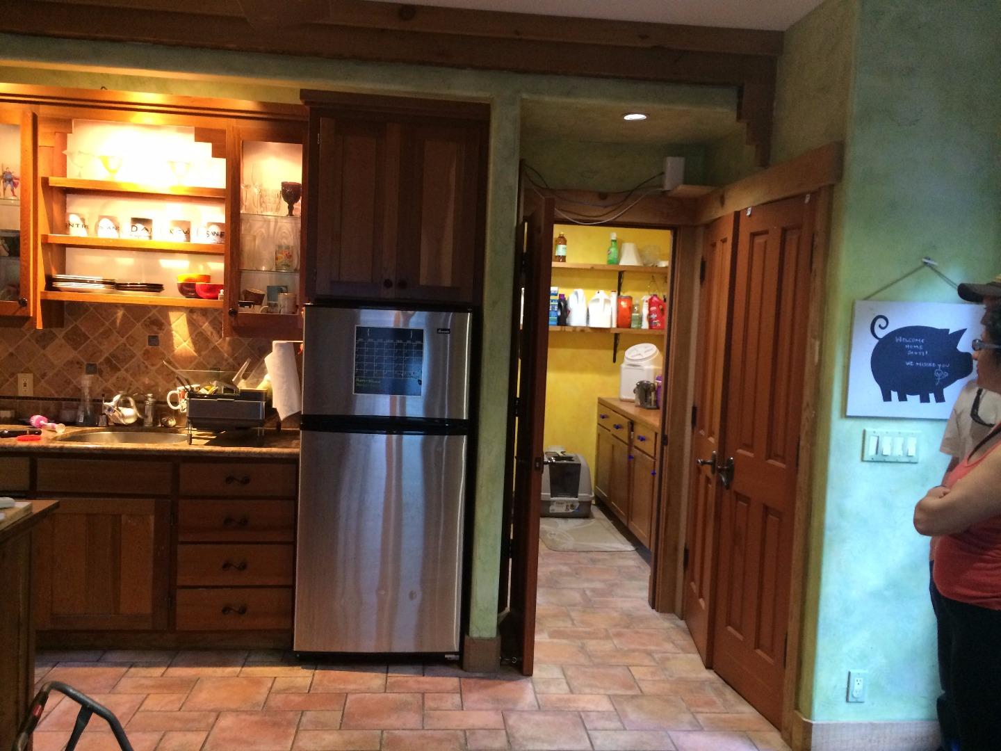 Sugarloaf Road Scotts Valley, CA 95066 - Photo 5 of 38 a kitchen with a refrigerator and cabinets