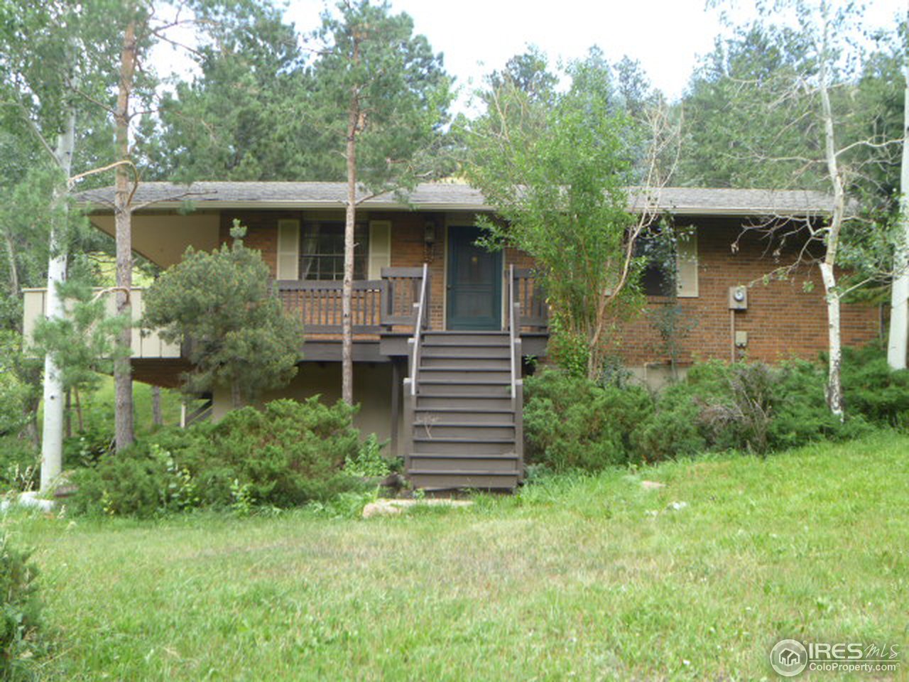 6940 Olde Stage Road Boulder, CO 80302 - Photo 1 of 14 a view of a house with a yard