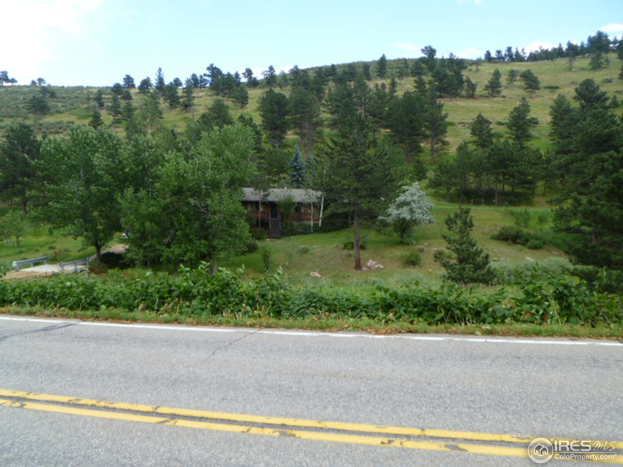 6940 Olde Stage Road Boulder, CO 80302 - Photo 2 of 14 an aerial view of residential houses with outdoor space and trees