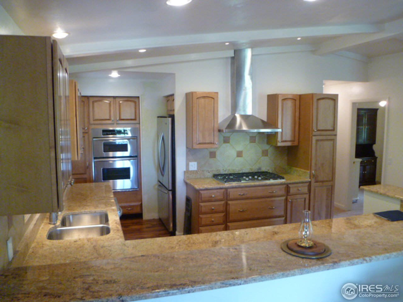 6940 Olde Stage Road Boulder, CO 80302 - Photo 7 of 14 a kitchen with stainless steel appliances granite countertop a refrigerator and a sink