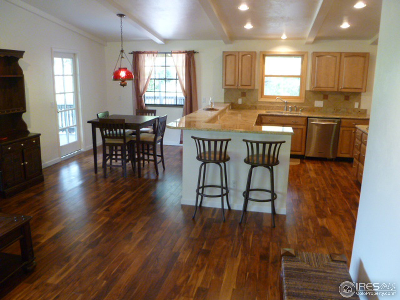 6940 Olde Stage Road Boulder, CO 80302 - Photo 9 of 14 a dining room with furniture and wooden floor