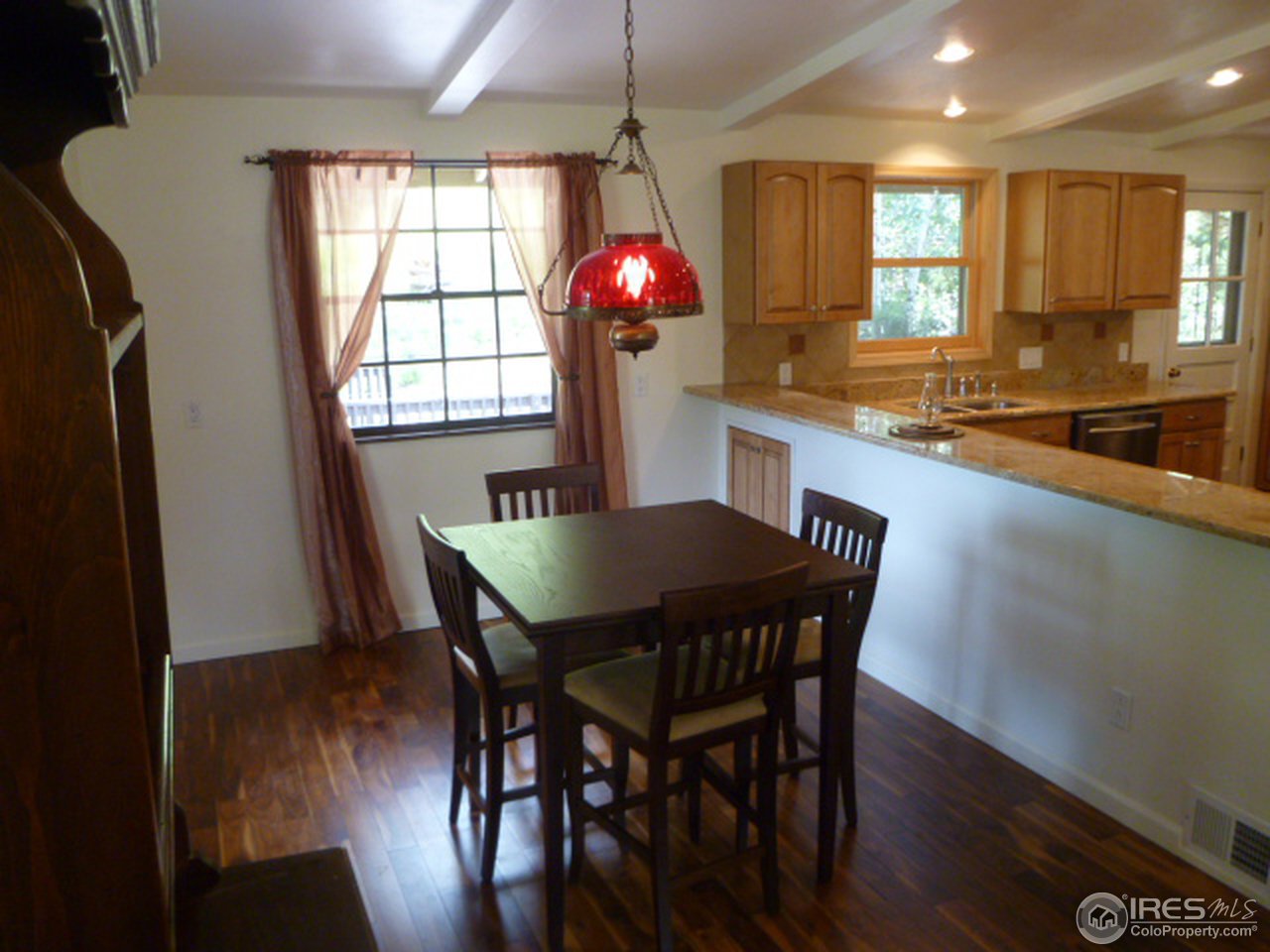 6940 Olde Stage Road Boulder, CO 80302 - Photo 10 of 14 a view of a dining room with furniture window and wooden floor