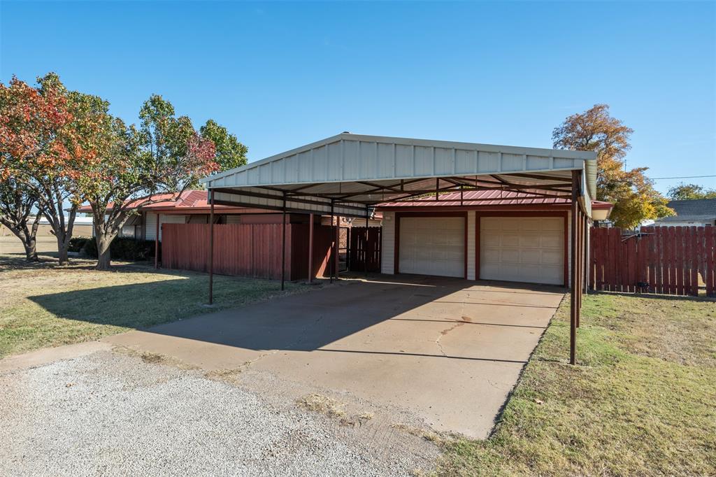 400 South Bailey Street Electra, TX 76360 - Photo 36 of 36 a front view of a house with a yard and garage