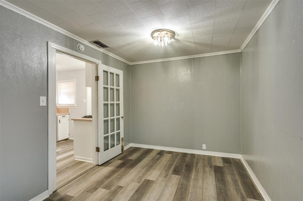 400 South Bailey Street Electra, TX 76360 - Photo 9 of 36 a view of an empty room and a gallery