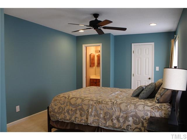 6924 Saxby Court Raleigh, NC 27613 - Photo 18 of 19 a bedroom with a bed and a window