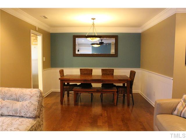 6924 Saxby Court Raleigh, NC 27613 - Photo 7 of 19 a view of a dining room with furniture and wooden floor