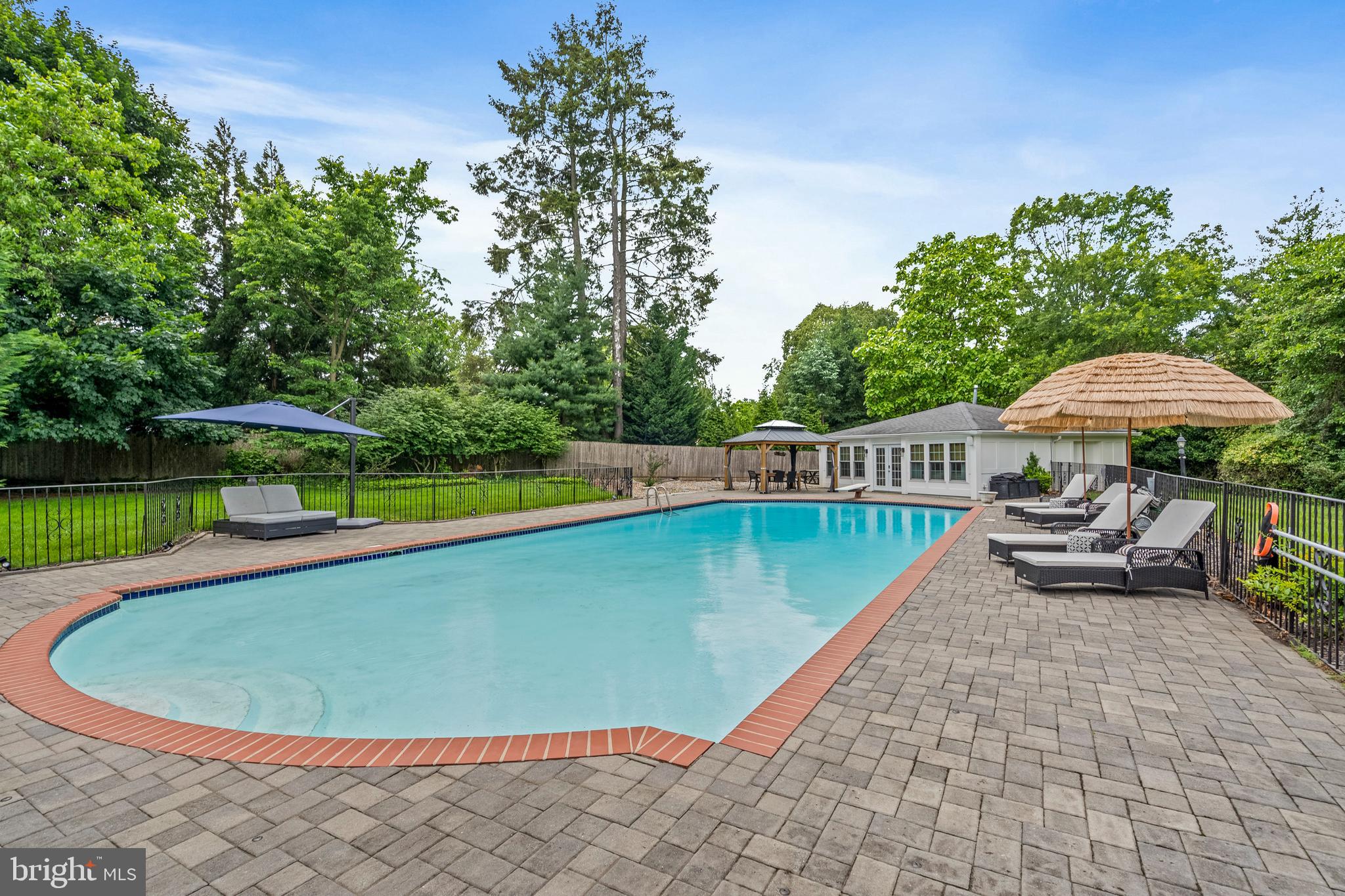 1179 Lafayette Road Wayne, PA 19087 - Photo 40 of 67 a view of a swimming pool and lounge chairs in back yard