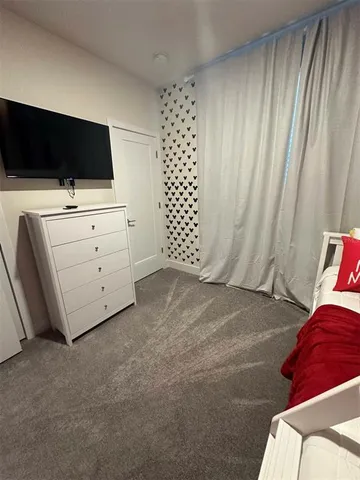 a view of a livingroom with furniture and flat screen tv