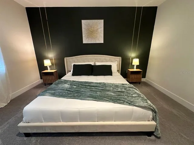 a bedroom with a bed and window