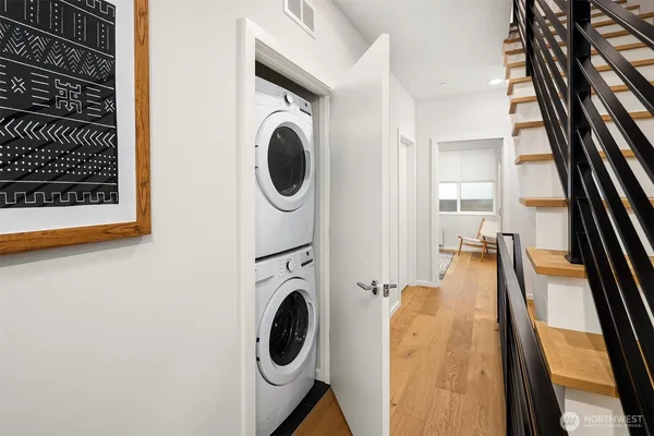 a view of a hallway with washer and dryer