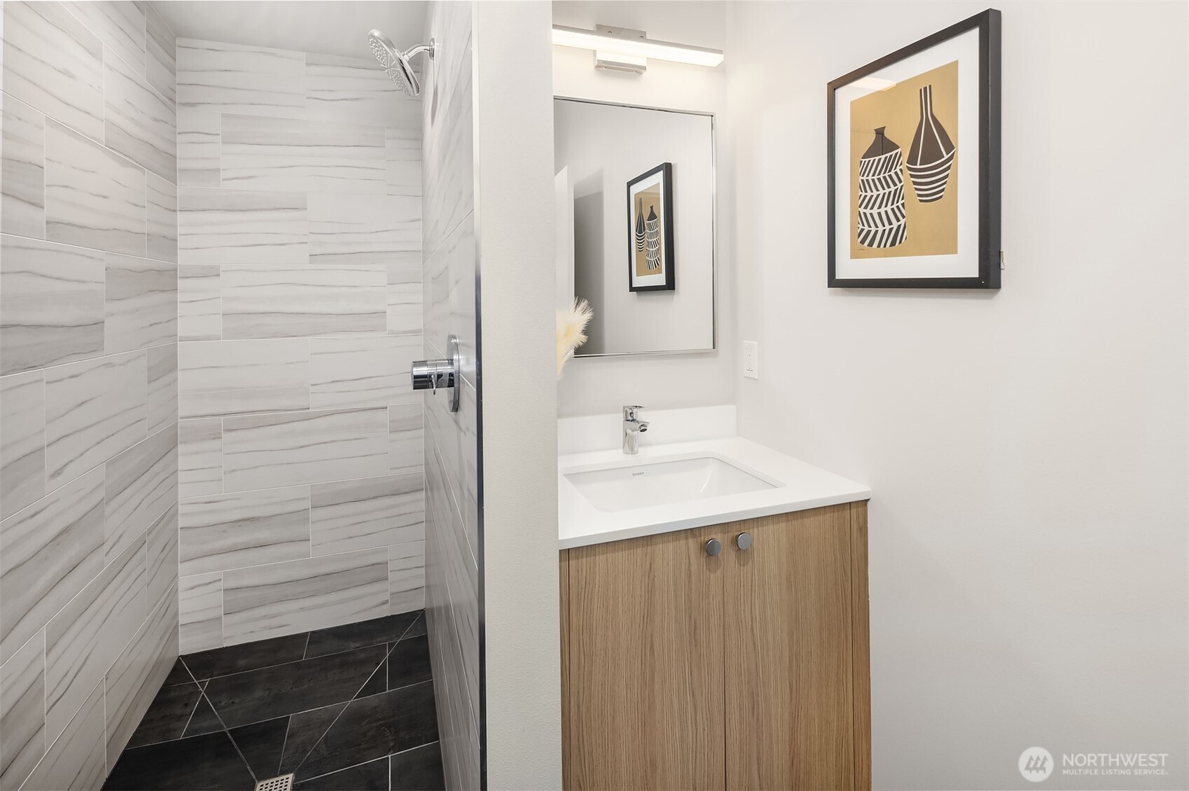 17342 Bothell Way Northeast, Unit H Bothell, WA 98011 - Photo 21 of 39 a bathroom with a sink and a mirror