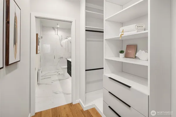 a bathroom with a shower and a sink