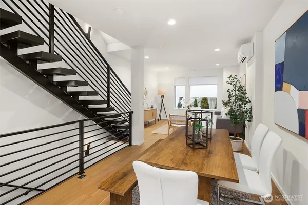 an entryway and dining room with furniture