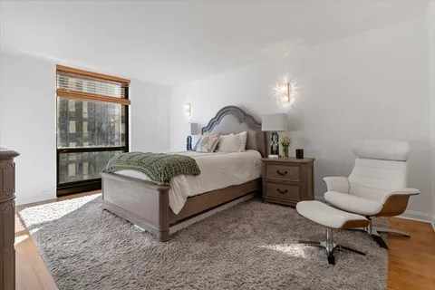 a bedroom with a bed and window