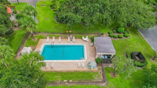 an aerial view of a house with garden space and street view