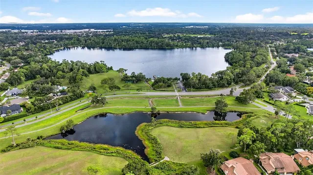 an aerial view of a house with a lake view