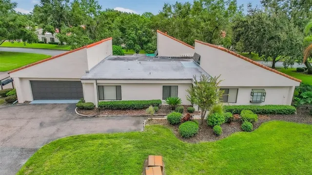 a kitchen with granite countertop stainless steel appliances a stove sink and refrigerator