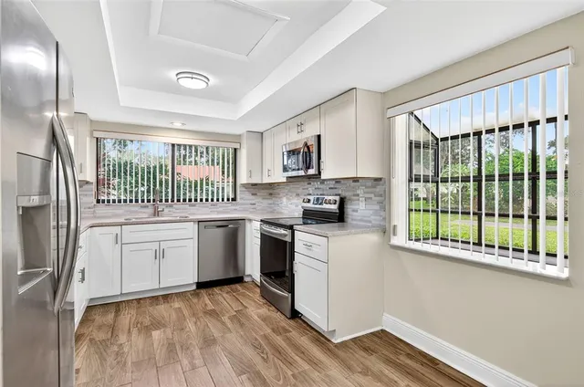 a kitchen with a stove and a microwave