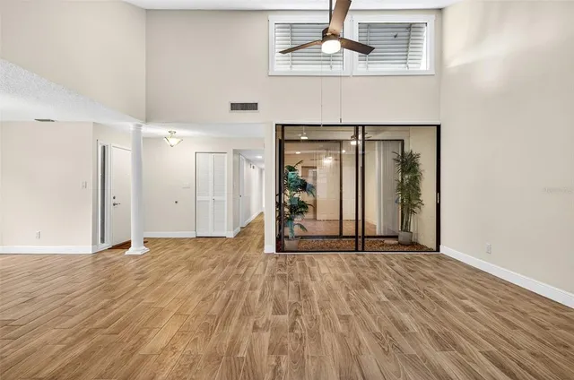 a view of an empty room with a glass door