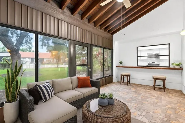 a living room with furniture and a large window