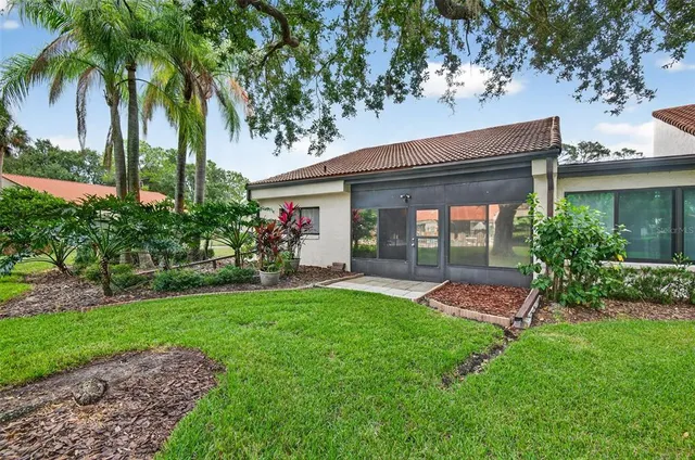 a terrace of a house with outdoor seating